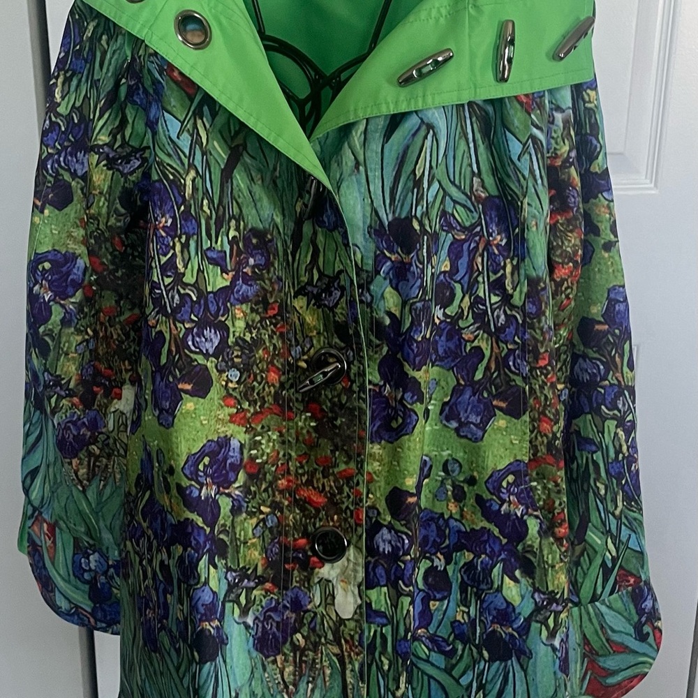 Reversible rain coat size small. Green on one side and floral on the other. Used